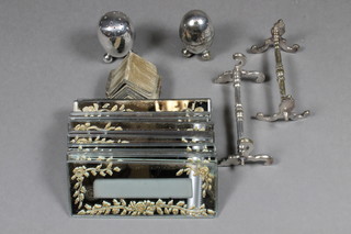 2 silver plated pepperettes, a pair of silver plated knife rests and  14 glass place name holders