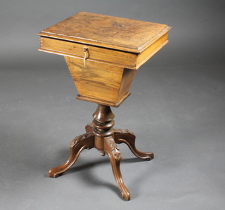 A Victorian figured walnut work table of tapering form with hinged lid, raised on pillar and quadripartite base 17"w x 14"d x  26"h