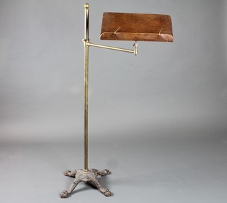 A Victorian iron and brass reading stand