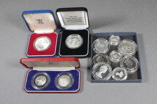 2 Republic of Dominica silver proof 20 Ariary coins and a do.  10, a Lesotho silver proof 10 Maloti coin, a 1991 New Zealand  silver proof 10 dollar rugy world cup coin and 8 various silver  proof coins