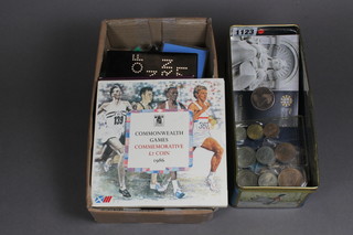 A collection of English silver coins, proof sets and crowns