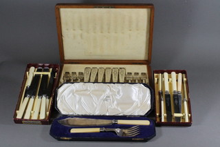 A pair of silver plated fish servers and a set of old fish knives  and forks in an oak canteen box and 2 cased sets of table knives,  etc