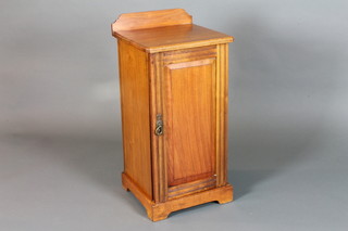 A Victorian walnut pot cupboard with raised back enclosed by a panelled door 31"h x 15"w x 15"d