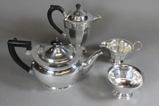 An oval Georgian style silver plated teapot, an Art Deco style  hotwater jug, matching sugar bowl and cream jug