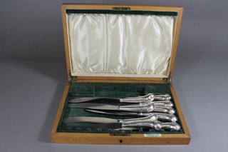 9 19th Century pistol grip handled table knives in an oak Harrods canteen box