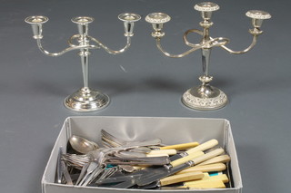 2 silver plated 3 light candelabrum and a collection of silver plated flatware