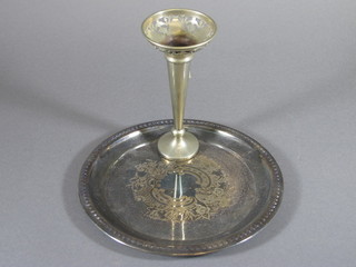 A circular silver plated engraved salver and a silver plated  trumpet shaped vase 6"