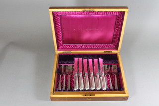 12 silver fruit knives with pistol grip handles, London 1860 together with 8 silver plated forks contained in a walnut canteen  box
