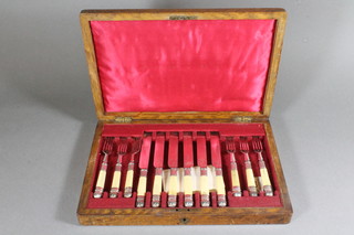 A set of 6 silver plated knives and forks by Mappin & Webb, in  an oak canteen box