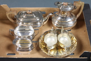 A Georgian style silver plated 4 piece tea service of oval cushion form with teapot, sugar bowl, milk jug and hotwater jug and  other silver plated items