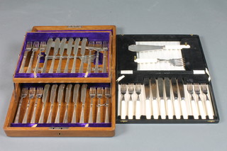 2 sets of 6 silver plated fish knives and forks with matching servers, cased