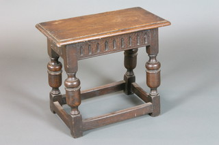 A carved oak joint stool with colonnade decoration, raised on turned and block supports 18"h x 20"w x 10"d