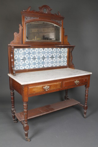 A Victorian walnut wash stand with raised tiled back fitted an  oval plate mirror and marble top, fitted 2 long drawers, raised on  turned supports with undertier 66"h x 42"w x 20"d