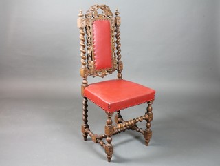 A Victorian carved oak Carolean style high back hall chair with upholstered seat and back, raised on turned supports