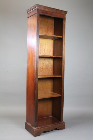 A Georgian style mahogany bookcase with moulded and dentil cornice, fitted adjustable shelves flanked by a pair of fluted  columns 73"h x 22"w x 12"d