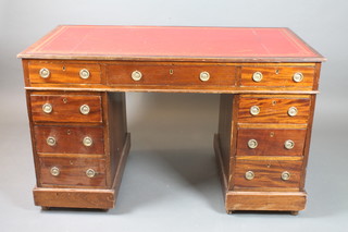 A Victorian mahogany pedestal desk with inset red leather skiver above 1 long and 8 short drawers 27"h x 47"w x 25"d