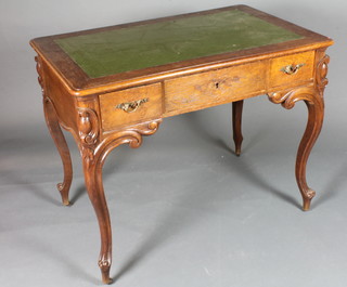 A 19th Century Continental oak writing table with inset green leather skiver, above 1 long and 2 short drawers, raised on  shaped cabriole supports 31"h x 39"w x 25"d