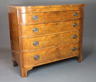 A George III mahogany bow front chest of 4 long drawers with  brass swan neck handles and with reeded pilasters, on shaped feet  41"h x 48"w x 21.5"d  ILLUSTRATED