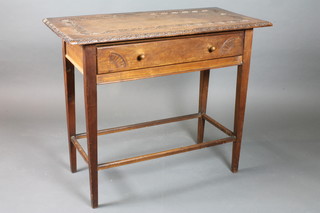 A rectangular carved mahogany side table fitted a drawer, raised on square tapering supports united by a box framed stretcher  29"h x 36"w x 18"d