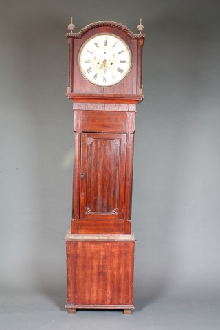 Sam Ashton, Ashburne, a 19th Century stained pine longcase  clock, having circular floral painted Arabic and Roman dial, set  second subsidiary dial and date aperture and having an associated  8 day movement, striking bell. The case with gadrooned  moulded hood above a panelled trunk door on box base, 76"h x  20"w