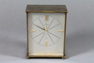 A 1960's gilt brass mantel timepiece, retailed by Garrards, having silvered baton dial and set 8 day cylinder movement,  bears inscription to top, 5.5"h x 4.5"w