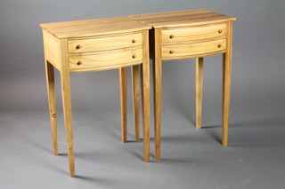A pair of Georgian style bleached mahogany bow front bedside  tables of 2 long drawers, raised on square tapering supports  18"w x 14"d x 27"h