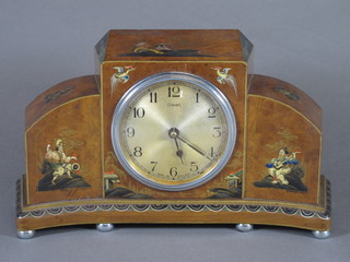 Ferranti, an early 20th Century walnut mantel timepiece, the  concave case decorated with chinoiserie scenes of figures  amongst a stylised landscape, having Arabic dial and electric  movement 5.75"h x 10.25"w