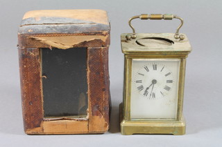 A late 19th Century French gilt brass carriage timepiece with corniche case and enamelled Arabic dial, af, 5.5"h x 4"w