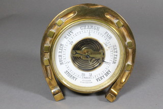 Of equine interest, an unusual late 19th Century polished brass desk aneroid barometer, fashioned with a horseshoe bezel 5"h x  5"w