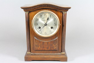 P. Orr & Sons Ltd, Madras and Rangoon, an early 20th Century  oak mantel clock, having silvered Arabic dial with outer minute  track, flanked by column supports and set 8 day movement  chiming gong, 11"h x 9"w