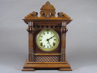 The Ansonia Clock Co. New York, a late 19th Century oak  mantel clock, parcel gilded, the architectural case with Roman  enamelled dial, set 8 day movement chiming gong, 14.5"h x  11"w x 5.5"d