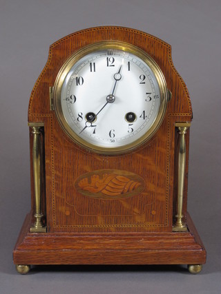 An Edwardian oak cased mantel clock decorated marquetry shell patterae and having Arabic enamelled dial, set 8 day movement,  chiming gong 10.25"h x 8"w x 5.25"d
