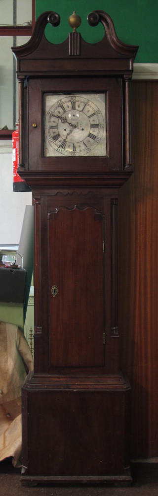 A George III mahogany longcase clock with silvered Arabic and Roman dial, second subsidiary dial, the 8 day 2 train movement  with anchor escapement, striking bell - lacking. The case with  broken swan neck pediment above a shaped trunk door flanked  by split quarter pilasters on box base 87"h x 21"w x 10"d