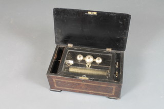 A late 19th Century Swiss walnut cylinder musical box, the case satinwood crossbanded and boxwood line inlaid, with hinged top  enclosing a musical cylinder playing 8 aires with visible bells,  raised on block feet 8.5"h x 18"w x 10.5"