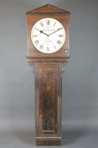 John Walker, South Molton Street, London. A Victorian oak  cased railway station regulator, having Roman painted dial with  out minute track and red painted Arabic numerals, the dial signed  and inscribed B.R.S, 696.B., set 8 day movement with anchor  escapement, the case of architectural form with pediment above a  rectangular trunk door flanked by acanthus leaf and scroll carved  shoulders, 82"h x 22"w, bears label to interior for Brighton &  Southcoast Railways and with original bill of sale from the  British Railways London Midland Region, Euston House  London,  ILLUSTRATED