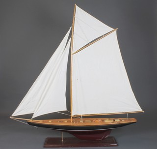 A wooden model of a racing yacht 48"