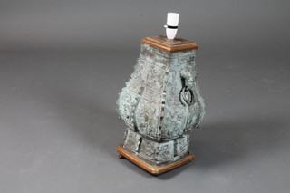 An Eastern bronze table lamp in the form of a twin handled urn  14"