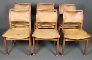 John Makepeace OBE, a set of 6 fruitwood leather bound dining chairs with concave seats, raised on square legs with ball feet,  stamped John Makepeace Workshops, Norman Illingworth 1981,