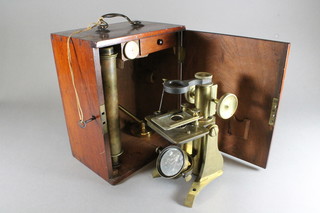 A brass single pillar field microscope