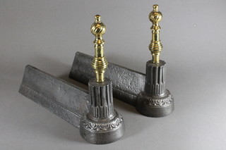 A pair of Victorian brass and iron fire dogs
