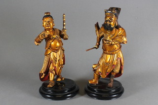 A pair of gilt figures of Eastern Deities 10"