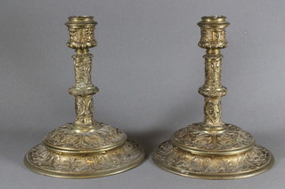 A pair of gilt metal 17th Century style cast brass candlesticks 9"