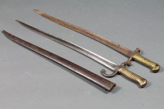 A chassepot bayonet complete with metal scabbard and 1 other - no scabbard