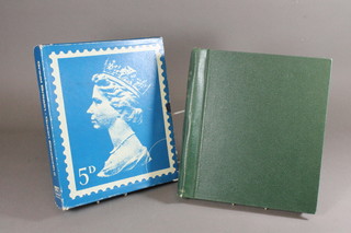 A green Windsor stamp album and a blue do. of GB stamps