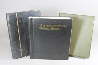 An International stamp album, a black stock book of GB stamps  and a black album of Jersey stamps and covers
