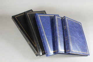 3 blue albums of postcards and 2 black loose leaf albums of postcards