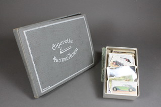 An album of cigarette cards and a box of cigarette cards