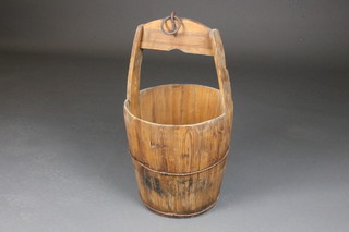 A wooden well bucket
