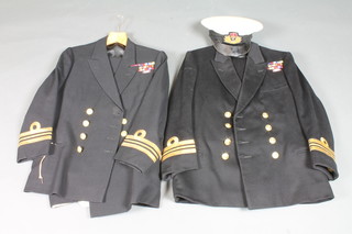 A Royal Navy Lieutenant Commander's tunic and trousers by  Whitaker together with 1 other cap and various epaulettes