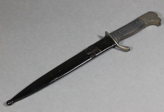 A paper knife in the form of a German dagger, the blade marked AEG  5.5" complete with scabbard